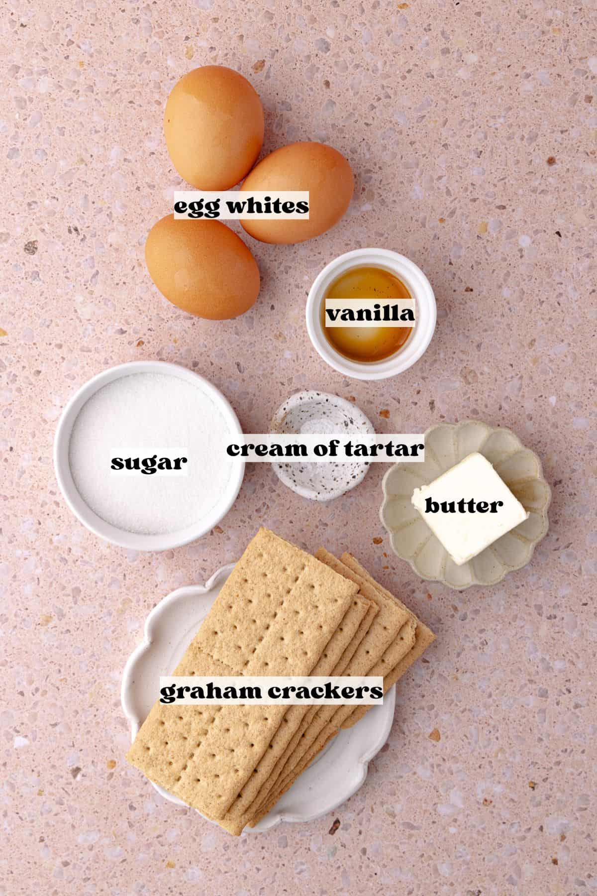 Chocolate s'mores ice cream add-ins, including homemade marshmallow meringue with egg whites, sugar, cream of tartar, vanilla and graham crackers and butter.