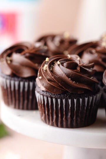 Chocolate hazelnut cupcakes filled with nutella hazelnut filling and frosted with a chocolate hazelnut buttercream feature photo.