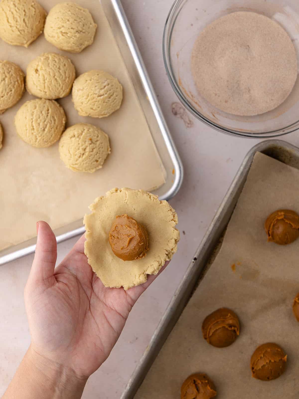 Snickerdoodle cookie dough balls are stuffed with dollops of Biscoff cookie butter.