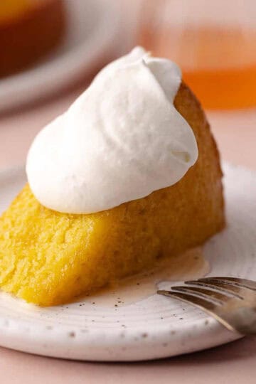 Grapefruit olive oil slice sitting on a dessert plate.