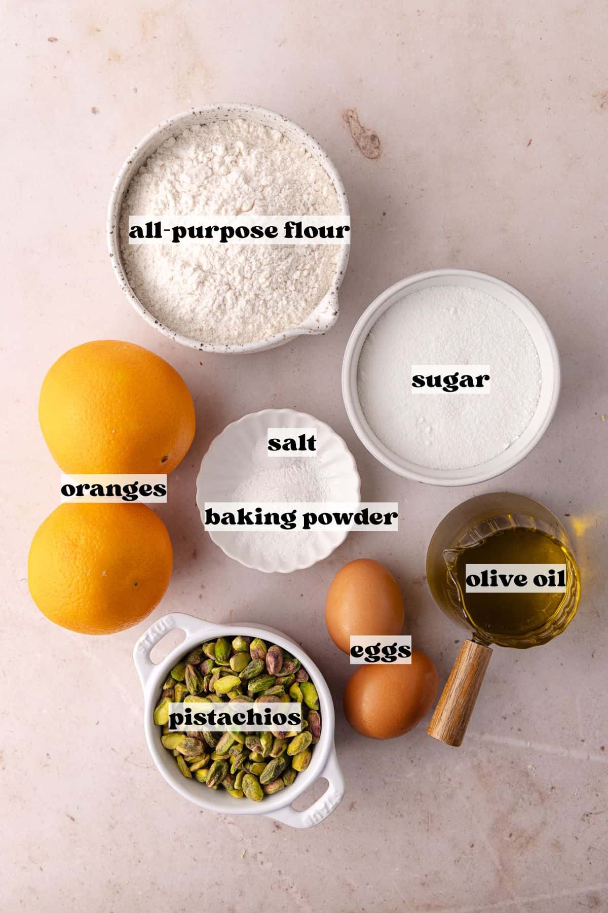 Pistachio Orange Olive Oil Cake ingredients which include, all-purpose flour, baking powder, salt, oranges, extra-virgin olive oil, eggs and pistchios.