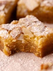 Almond frangipane blondies, also called almond croissant blondies are layered with a brown butter blondie batter, a brown butter almond frangipane and topped with sliced almonds.