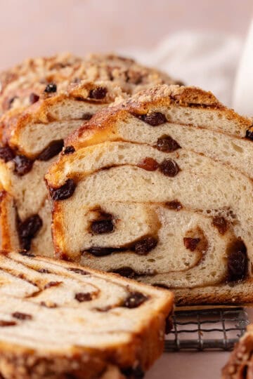 Cinnamon raisin brioche babka is swirled with cinnamon sugar filling and raisins and then topped with a streusel. The cinnamon raisin twist bread is soft and fluffy and cut into thick slices.