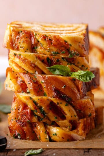 Soft and fluffy pizza babka features brioche dough filled with pizza sauce, mozzarella cheese, pepperoni and brushed with garlic butter.