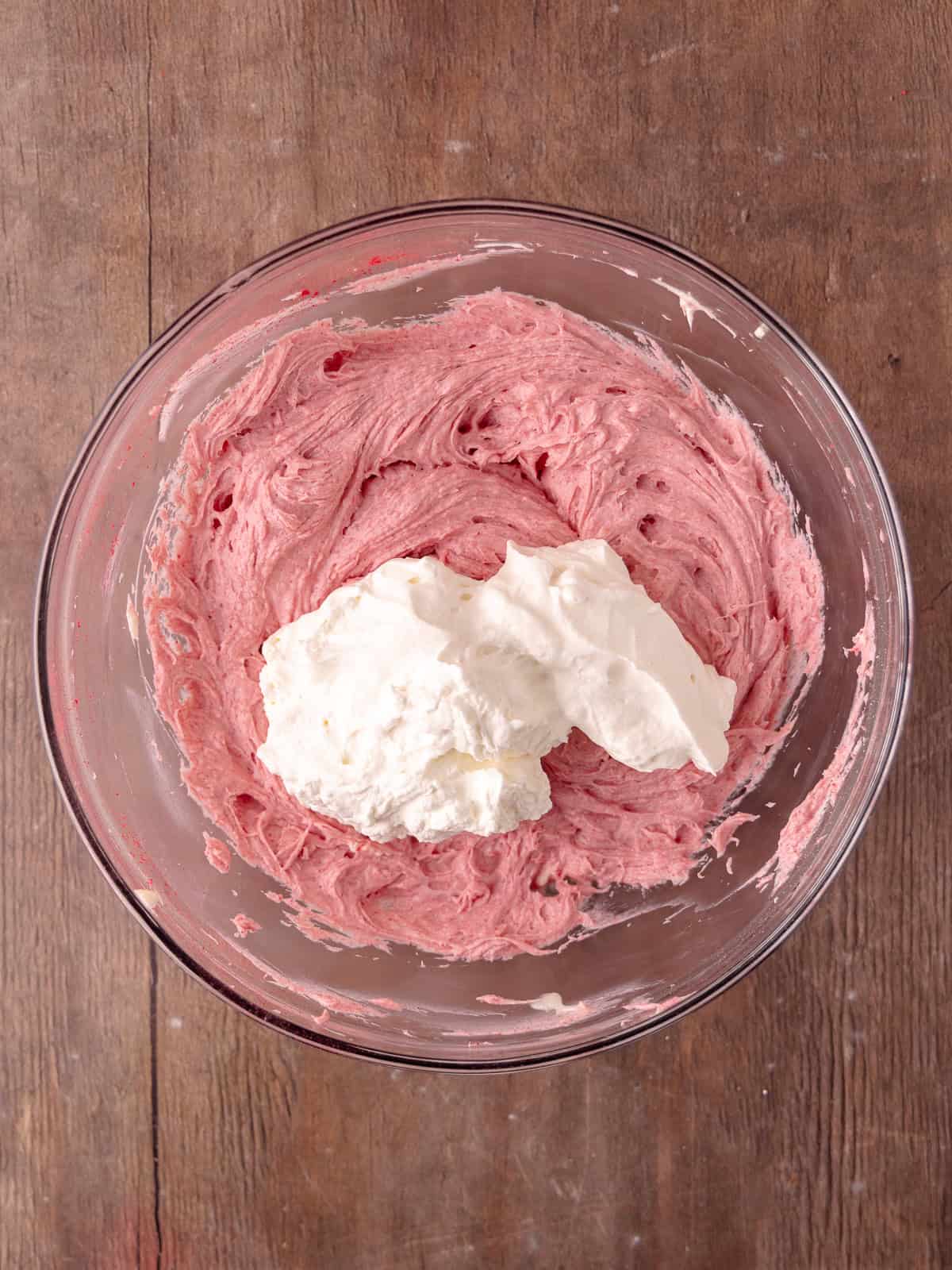 Whipped cream is folded into the raspberry white chocolate cream cheese mixture.