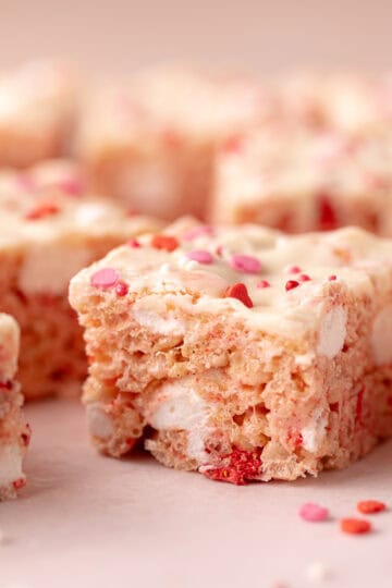 Strawberry rice Krispies treats with freeze-dried strawberries, mini marshmallows, white chocolate and sprinkles.