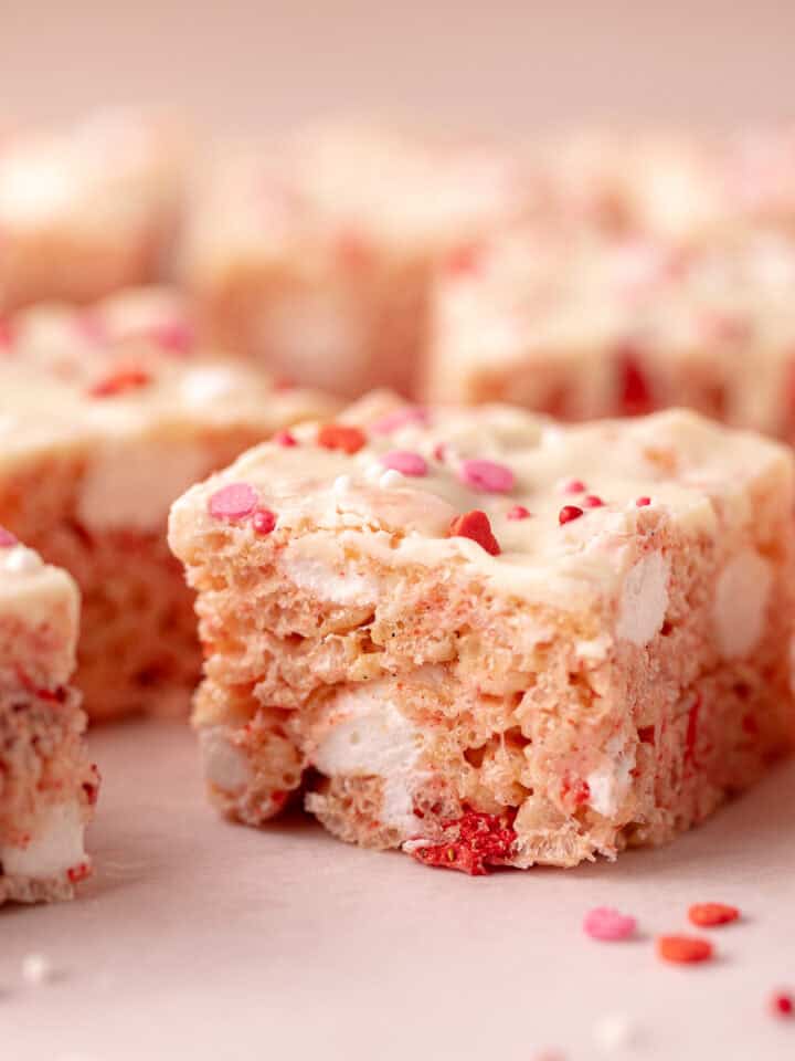 Strawberry rice Krispies treats with freeze-dried strawberries, mini marshmallows, white chocolate and sprinkles.