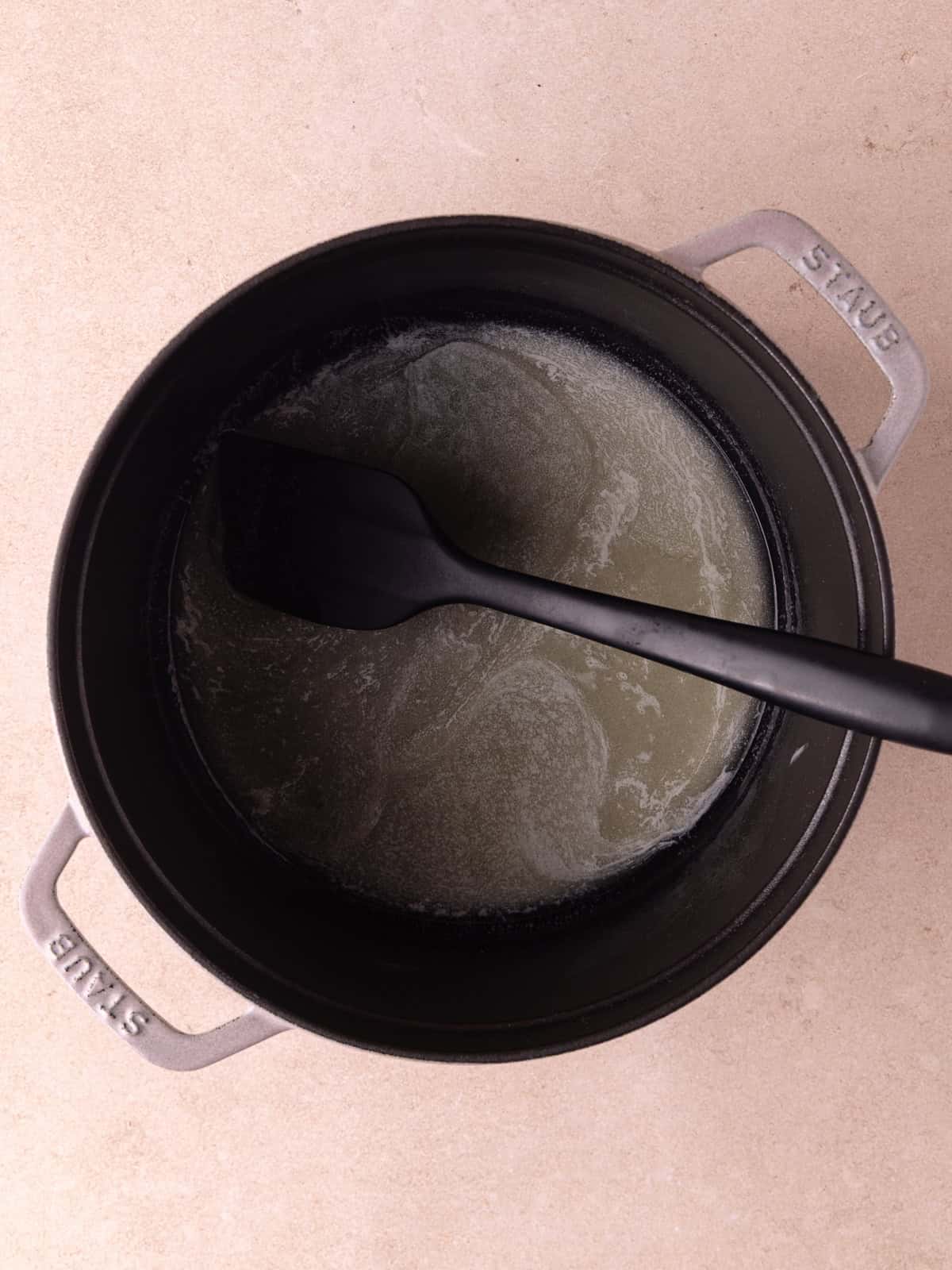 Butter is melted in a dutch oven.