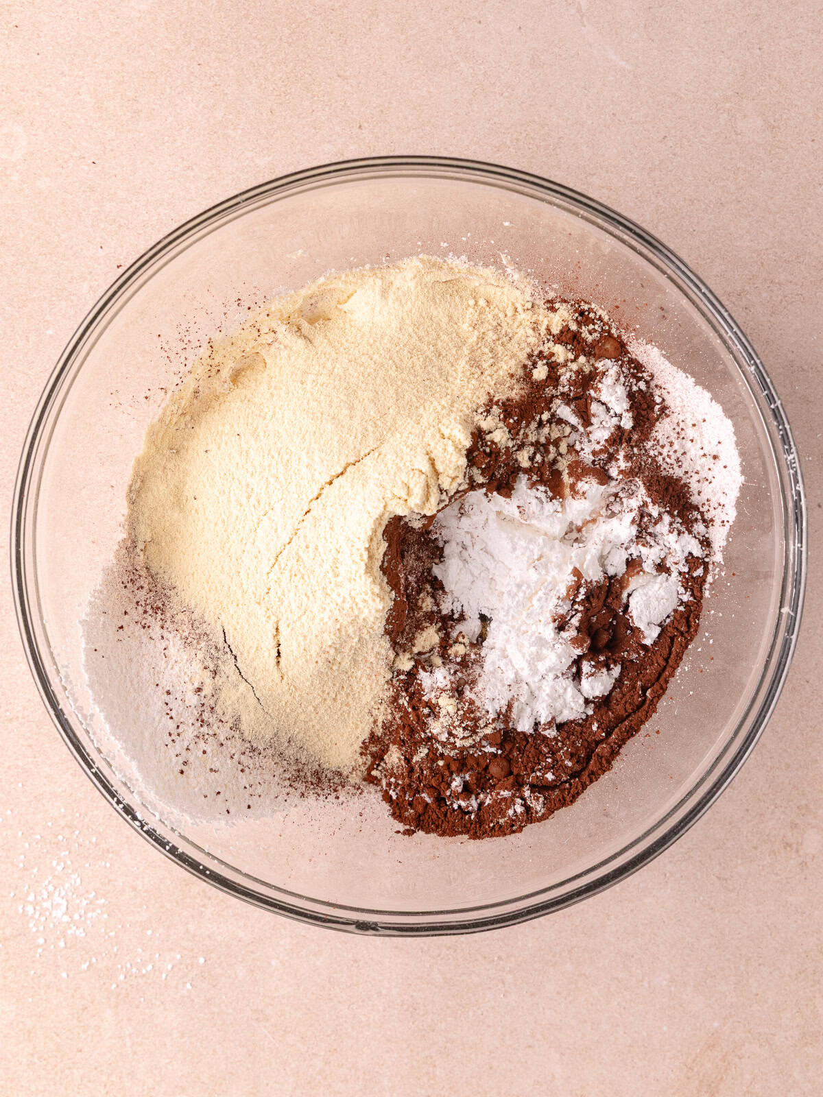 Butter, powdered sugar, dutch-process cocoa powder, malted milk powder, vanilla, milk and pinch of salt are in a large mixing bowl.