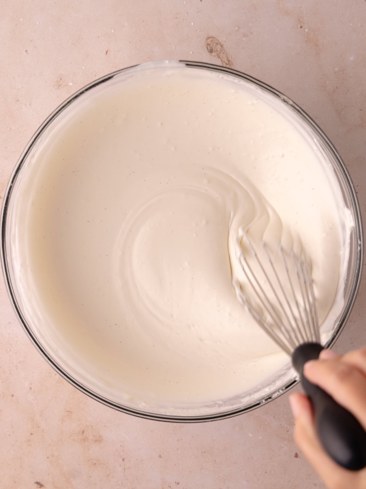 Coconut milk gelatin mixture is gradually mixed with the cream cheese whipped cream mixture.