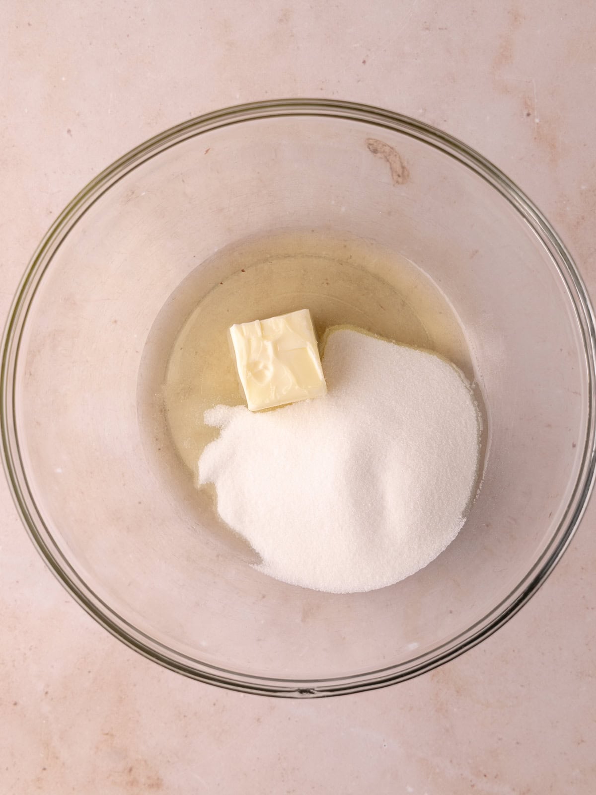 Softened butter, oil and sugar are in a large mixing bowl.
