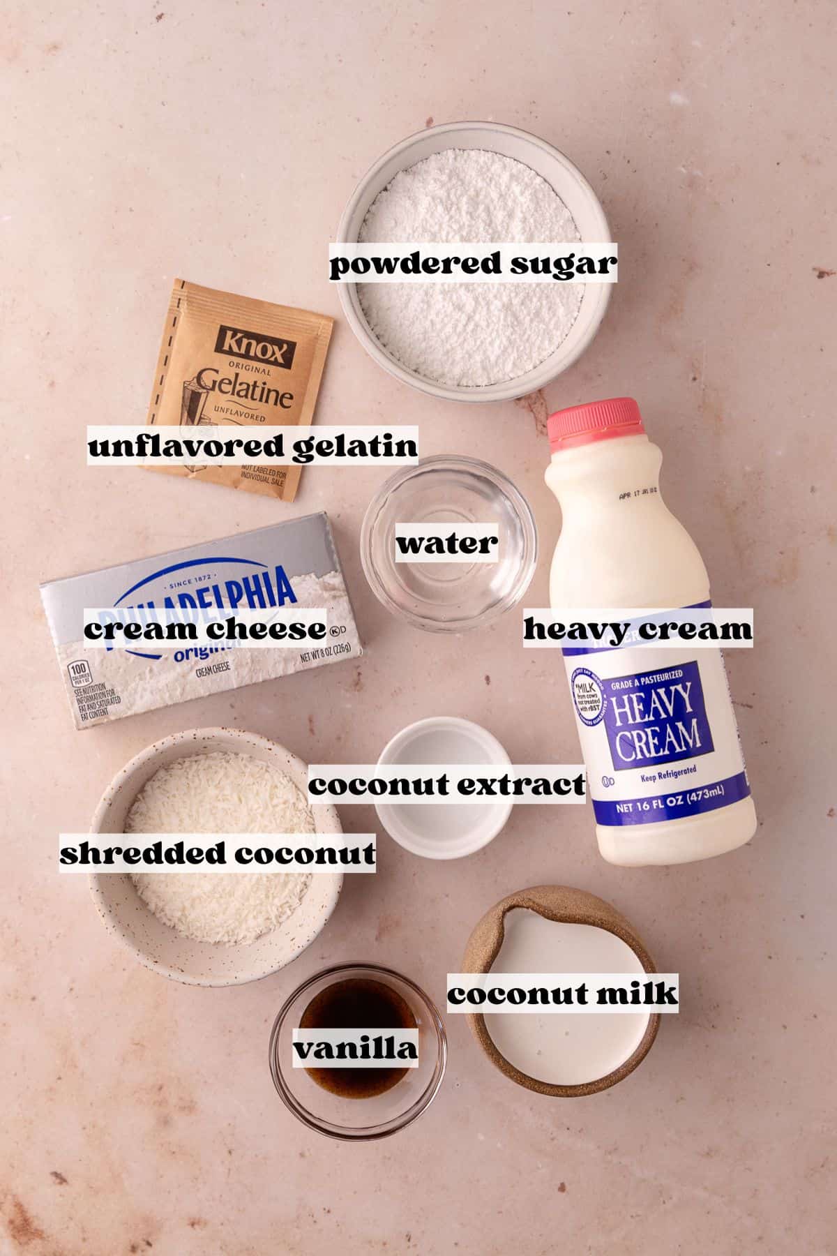 Coconut Mousse Layer ingredients which include, shredded coconut, coconut milk, unflavored gelatin, vanilla, cream cheese, heavy cream, coconut extract and powdered sugar.