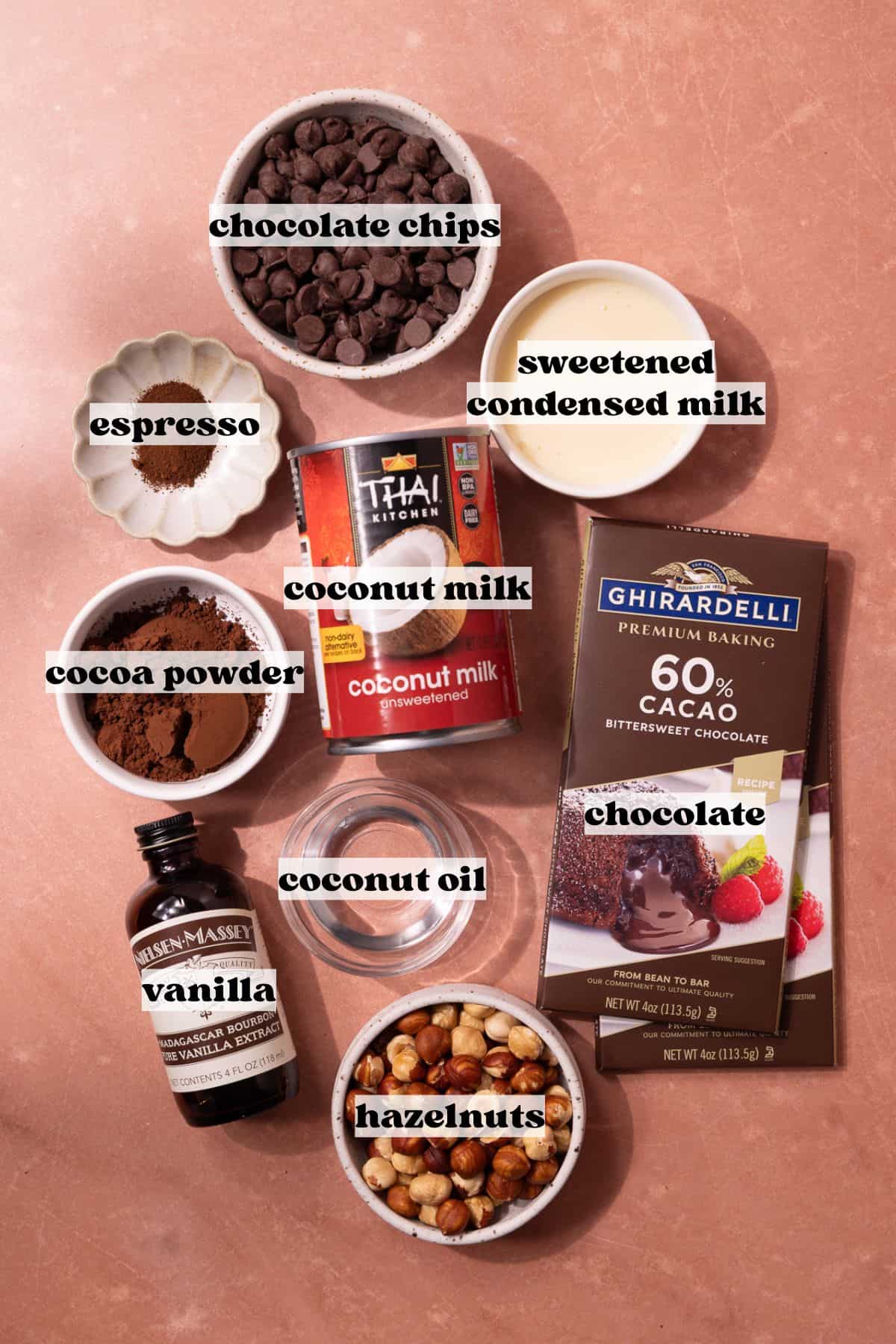 Magnum style creamy chocolate coconut popsicles, dipped in a hazelnut chocolate magic shell ingredients which include, canned coconut milk, sweetened condensed milk, chocolate chips, unsweetened cocoa powder, espresso powder, vanilla extract, chocolate bars, coconut oil and hazelnuts.