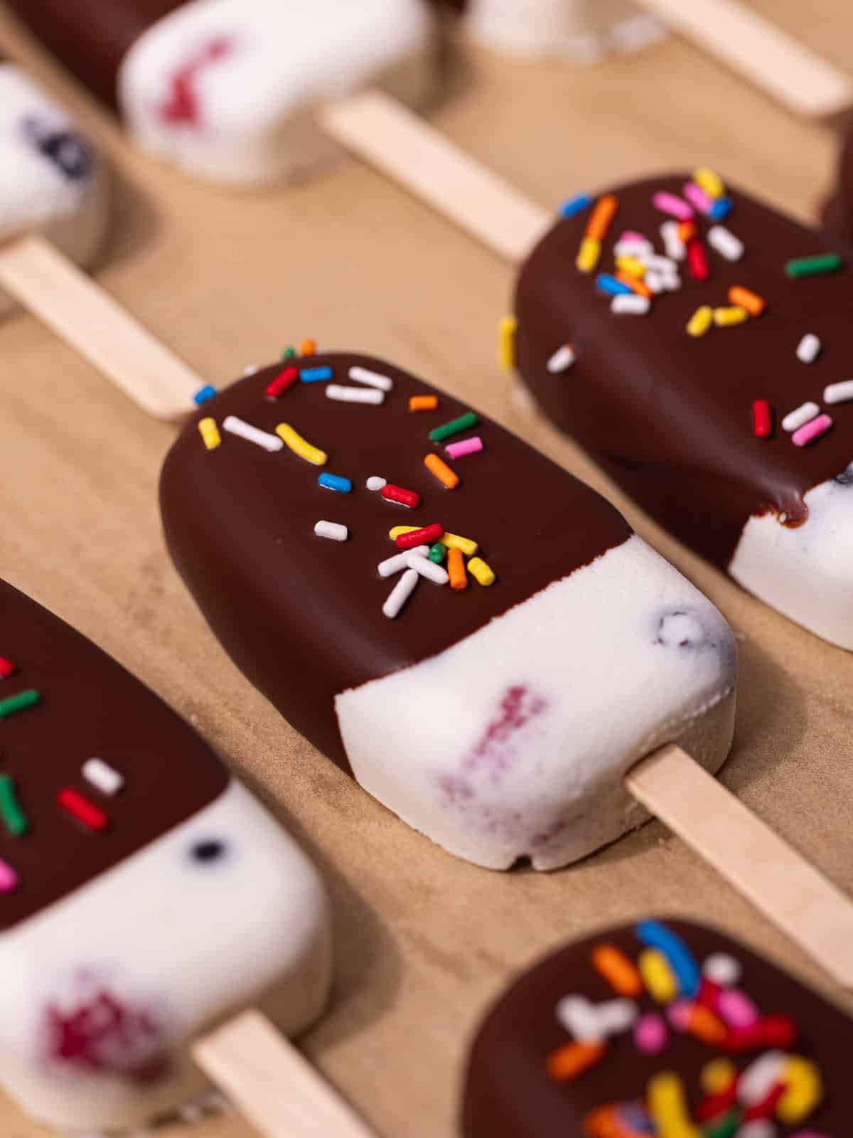Rainbow sprinkles are added on top of the magic chocolate shell.