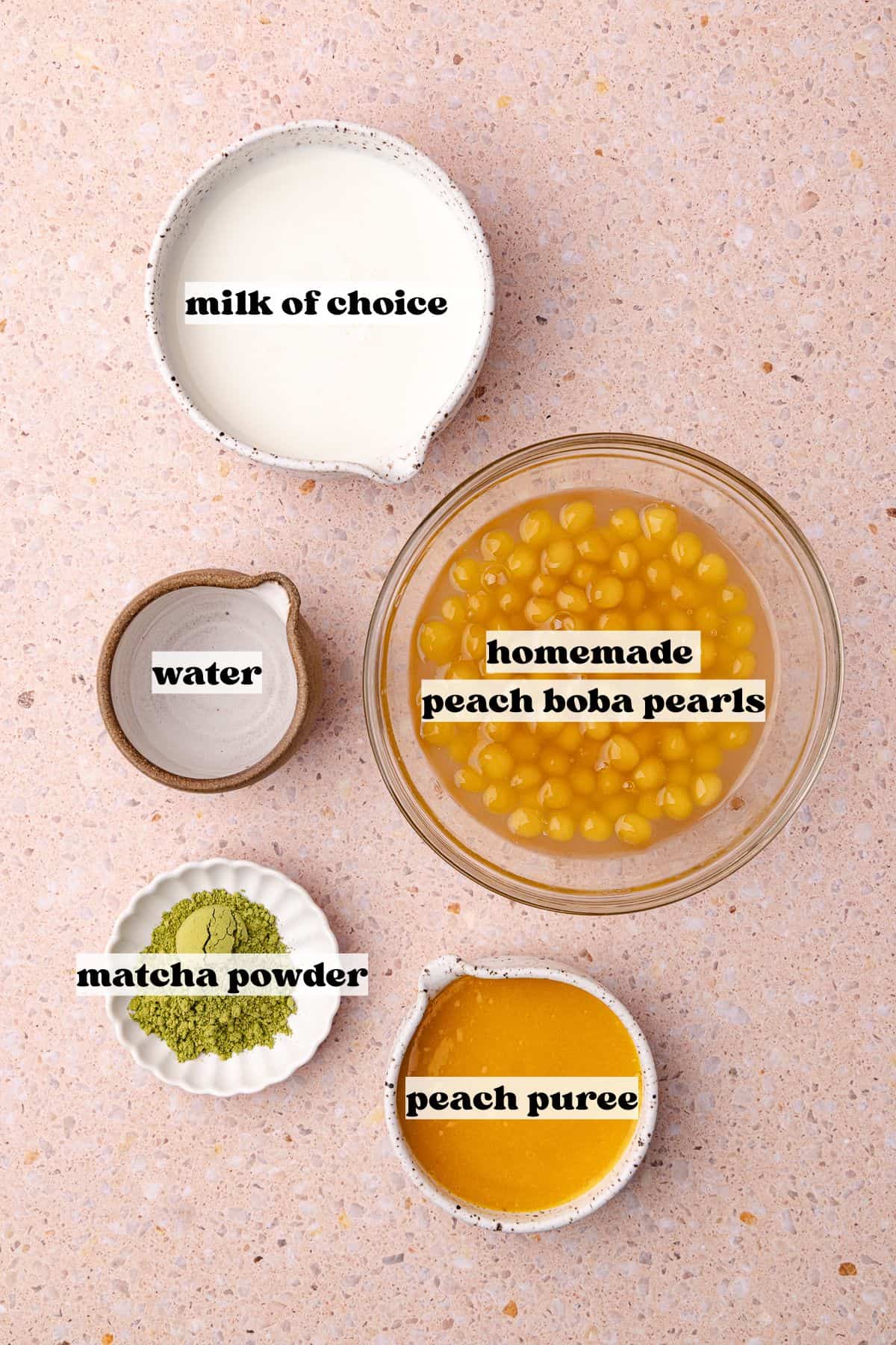 Peach matcha boba tea ingredients include, homemade peach boba pearls, peach puree, milk, matcha powder and water.