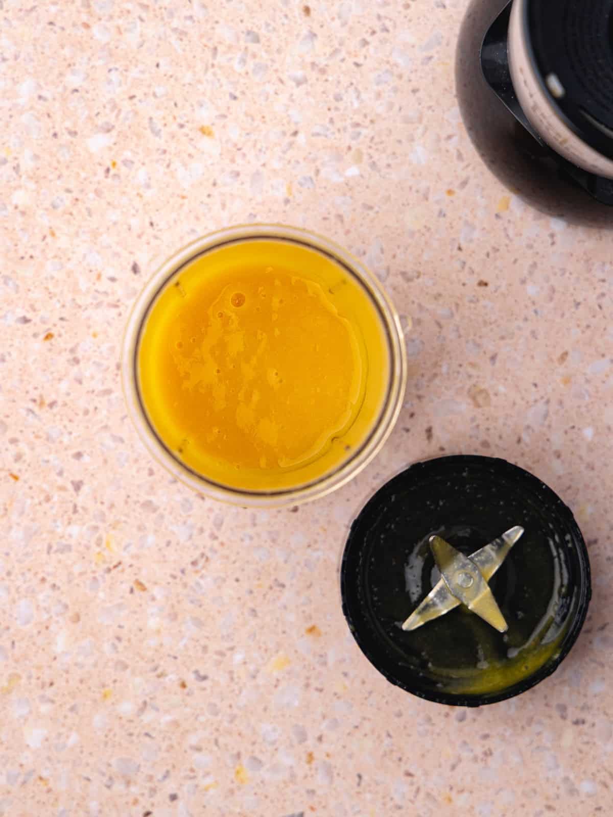 The drained sliced peaches and sugar are pureed together in a small blender until smooth.