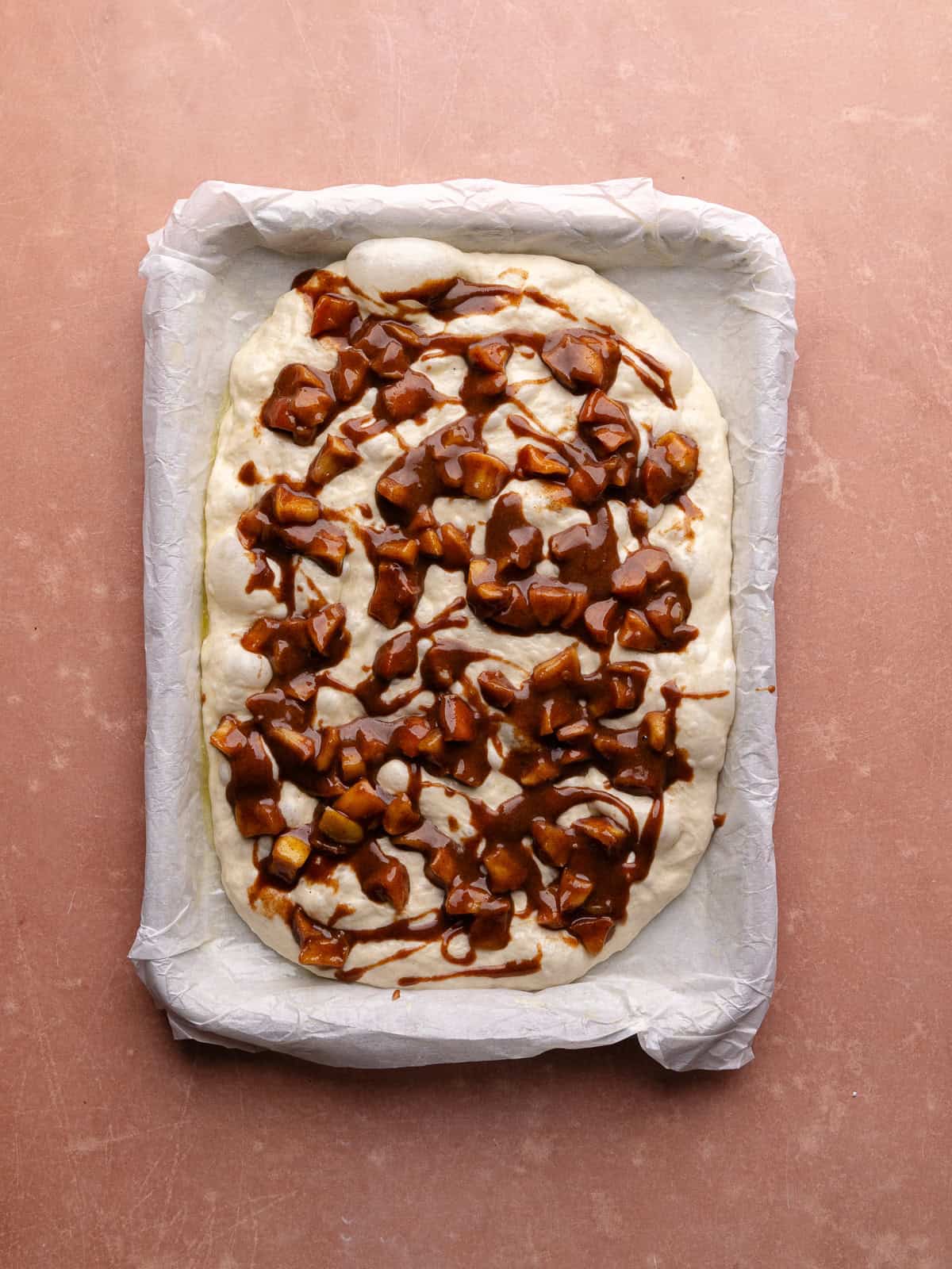 Apple fritter focaccia is stuffed with cinnamon apple filling.