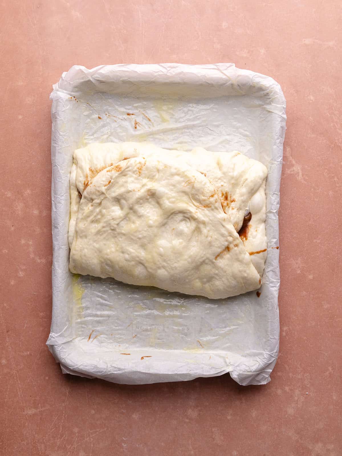 Apple fritter focaccia is stuffed with cinnamon apple filling.