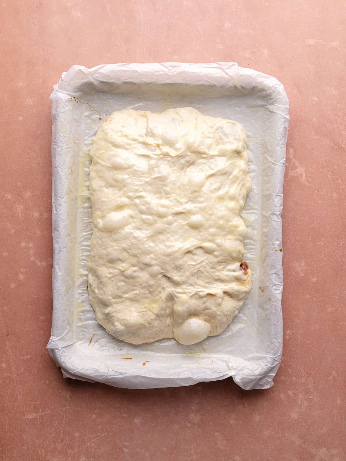Apple fritter focaccia is stuffed with cinnamon apple filling.