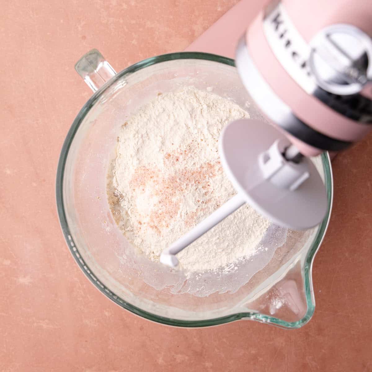 Tangzhong, milk, egg, bread flour, instant yeast and salt are in the bowl of a stand mixer.
