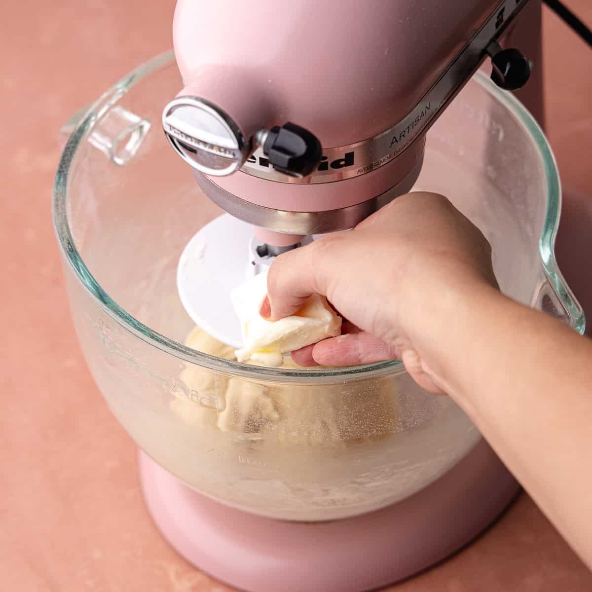 Softened butter is added to the milk bread dough.