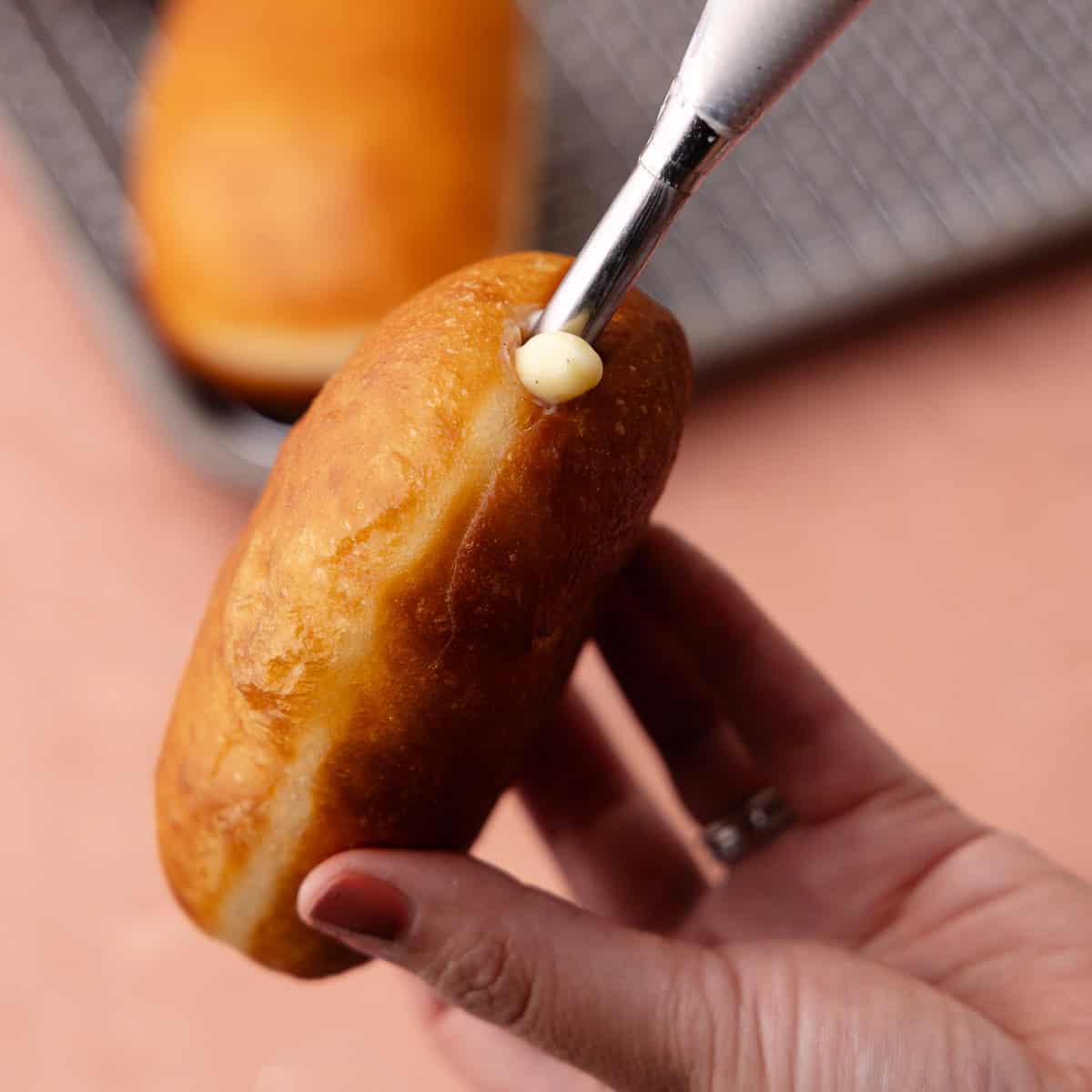 Maple donut bars are filled with vanilla pastry cream using a bismarck tip.