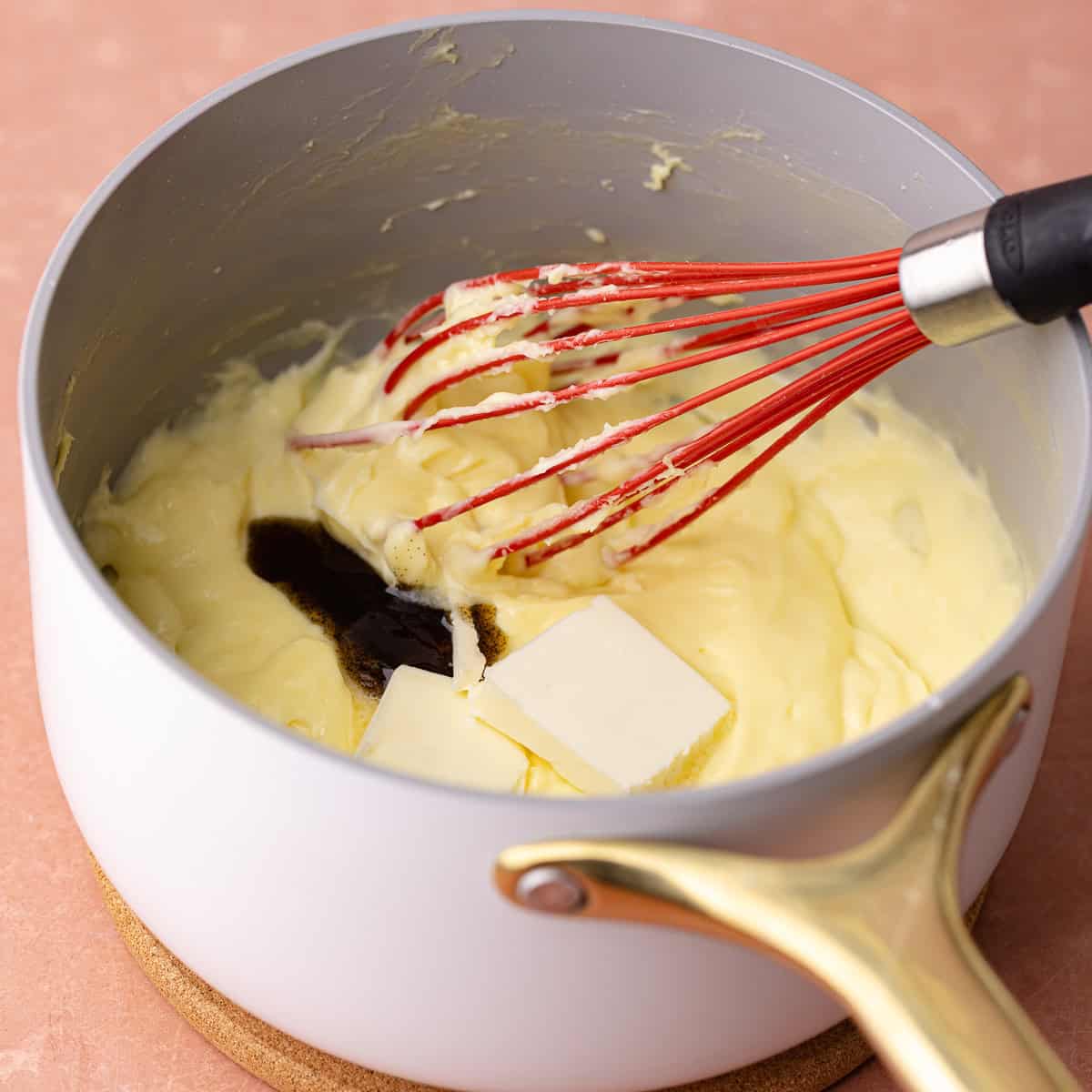 Cold butter and vanilla paste is added to the pastry cream.