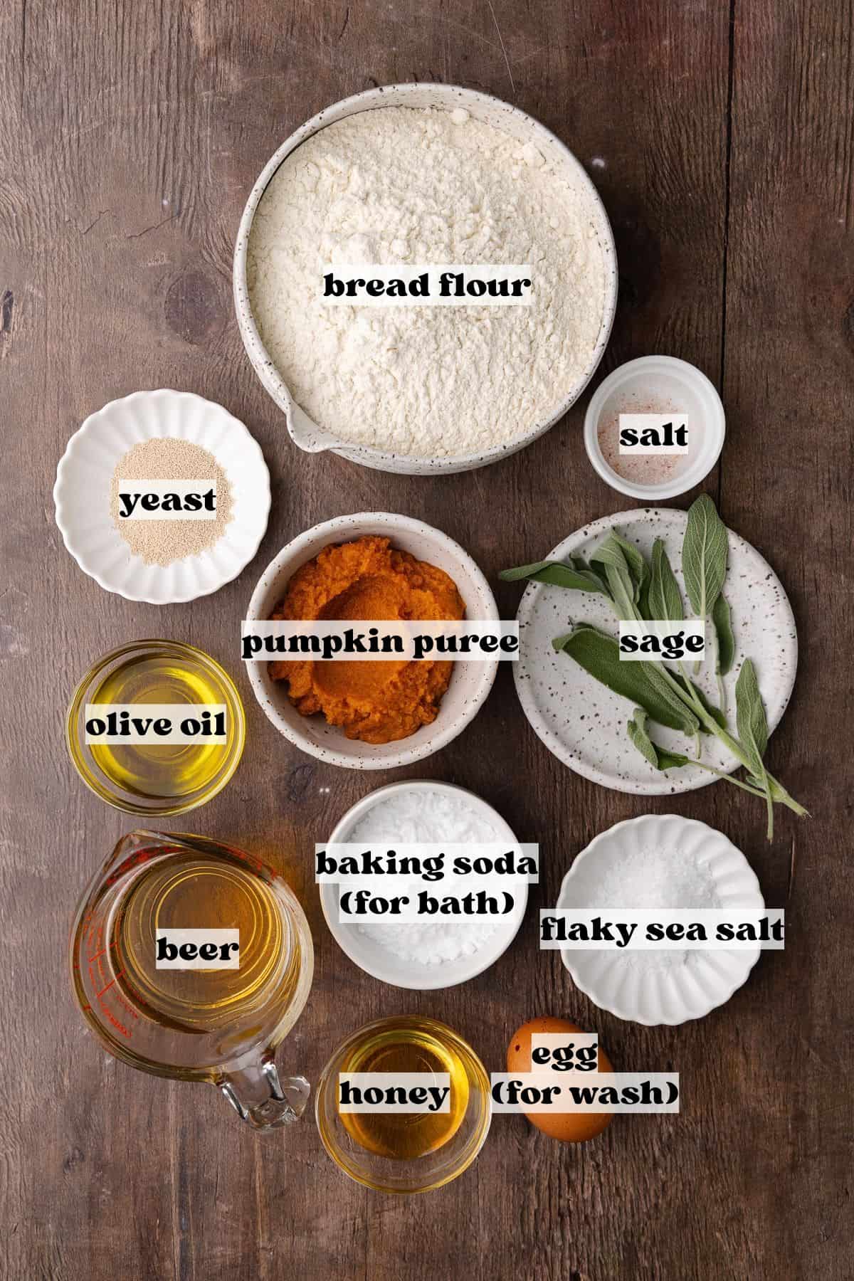 Soft pumpkin sage pretzels ingredients include beer, pumpkin puree, yeast, olive oil, honey, bread flour, salt, yeast, baking soda and egg.