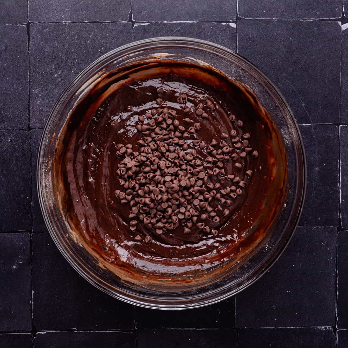 Mini semi sweet chocolate chips are added to the chocolate donut batter.